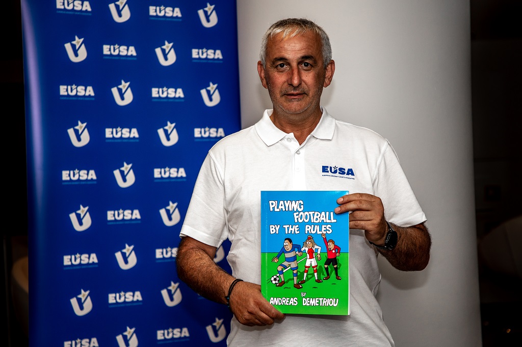 Mr Andreas Demetriou with his booklet on football 